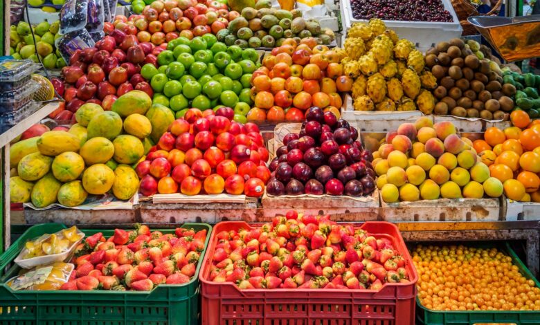 red and green apples on red plastic crate